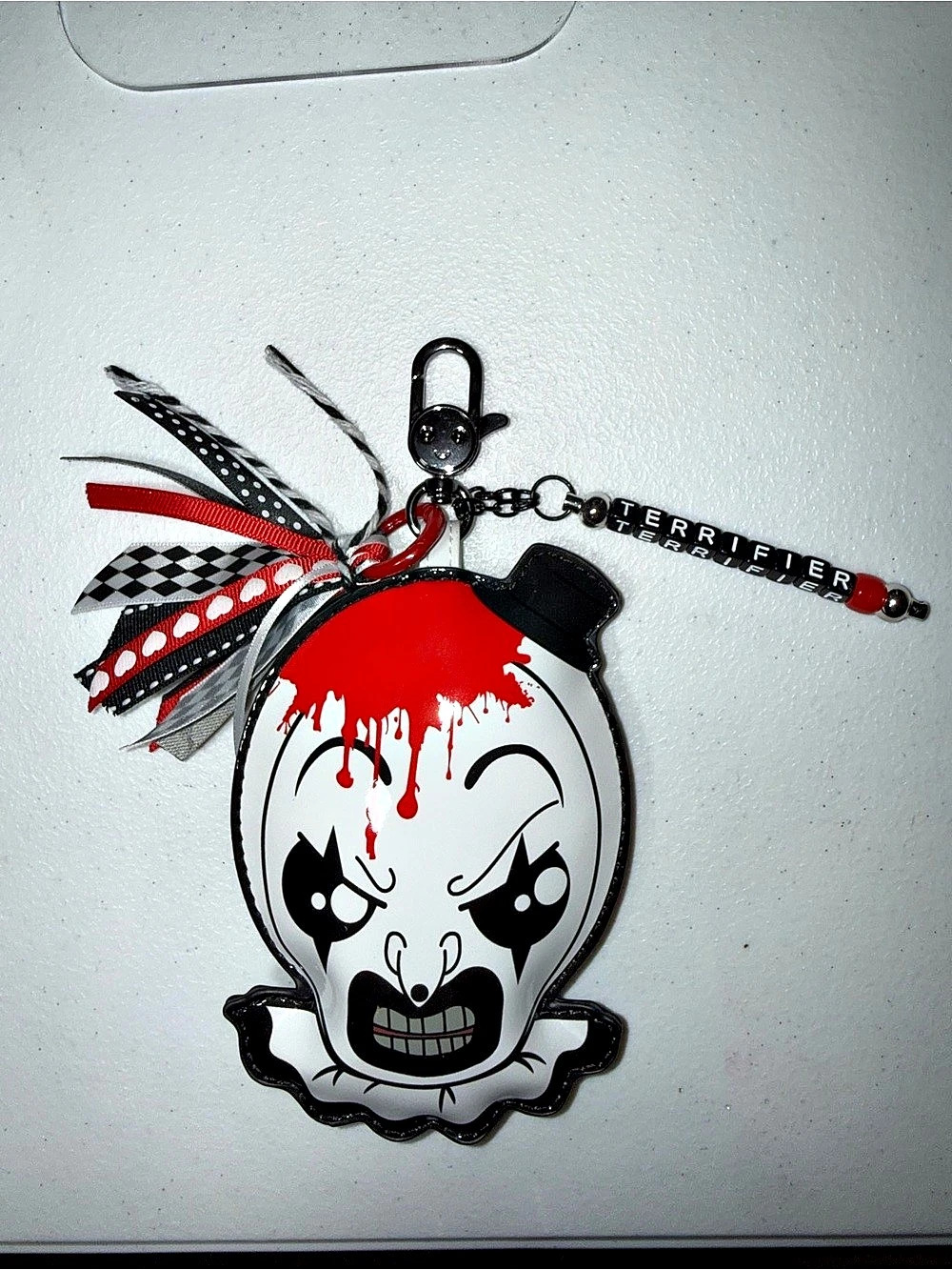 Terrifier 2 Whatever Makes You Happy keychain charm